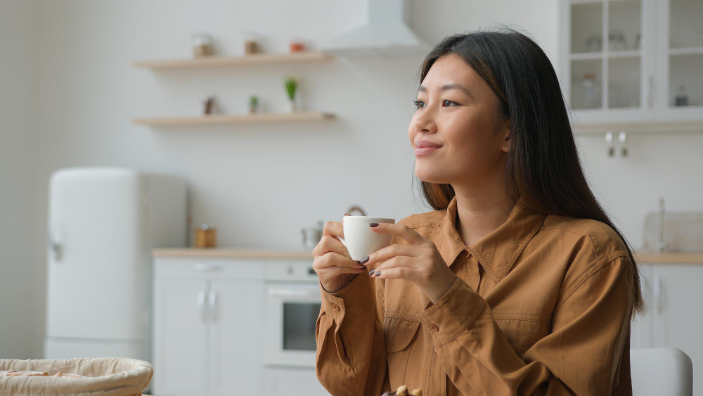 A woman enjoying her fruit tea